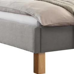 Graues Polster Bett Typon